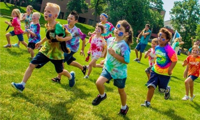 Boston Summer Camps | Kids Running on a field in Tie Dye Shirts